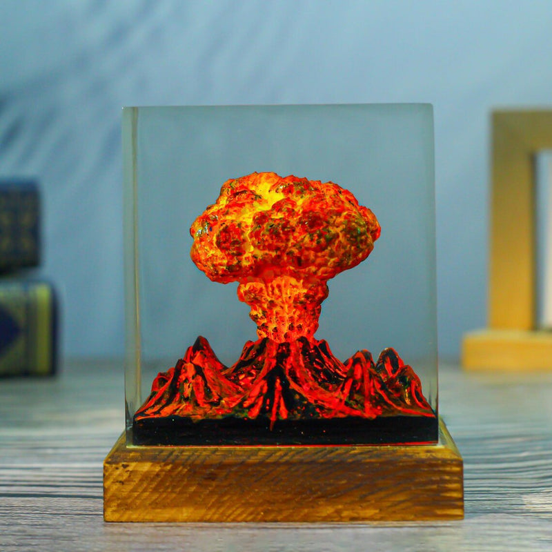 Volcano eruption cloud resin lamp on a weathered wood base