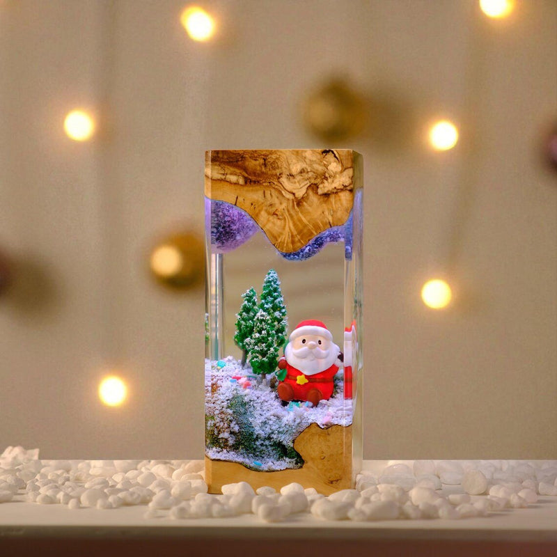 Santa Christmas resin lamp in light wood with bokeh lights