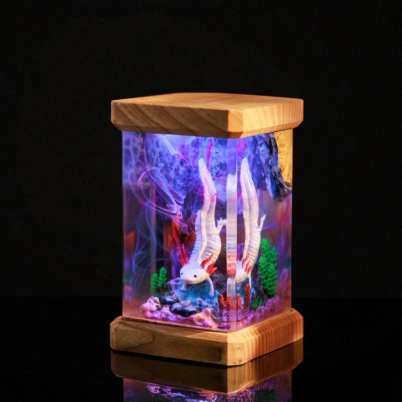 White axolotl resin lamp with wood top and base on black
