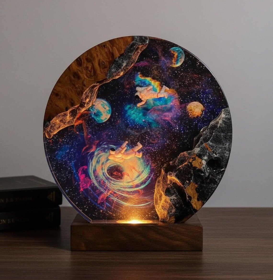 Galaxy epoxy lamp with two astronauts and planets in warm light