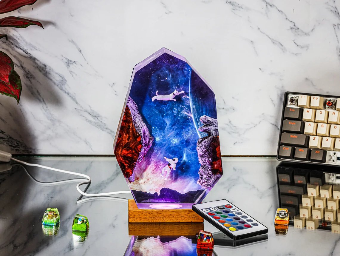 Astronaut cat space epoxy night light on a marble desk