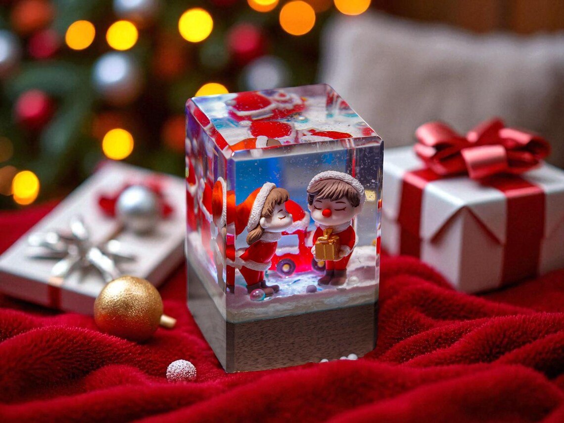 Christmas couple kiss resin cube on red velvet with gifts