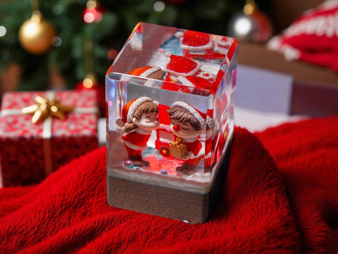 Christmas couple kiss cube lamp on a red blanket
