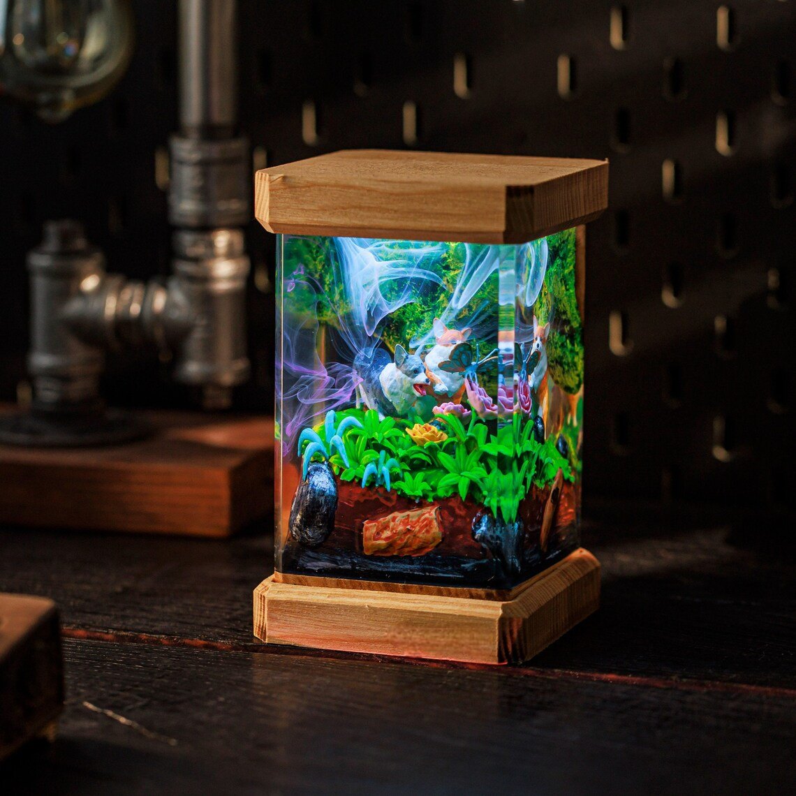 Two corgis garden epoxy night light on a dark shelf