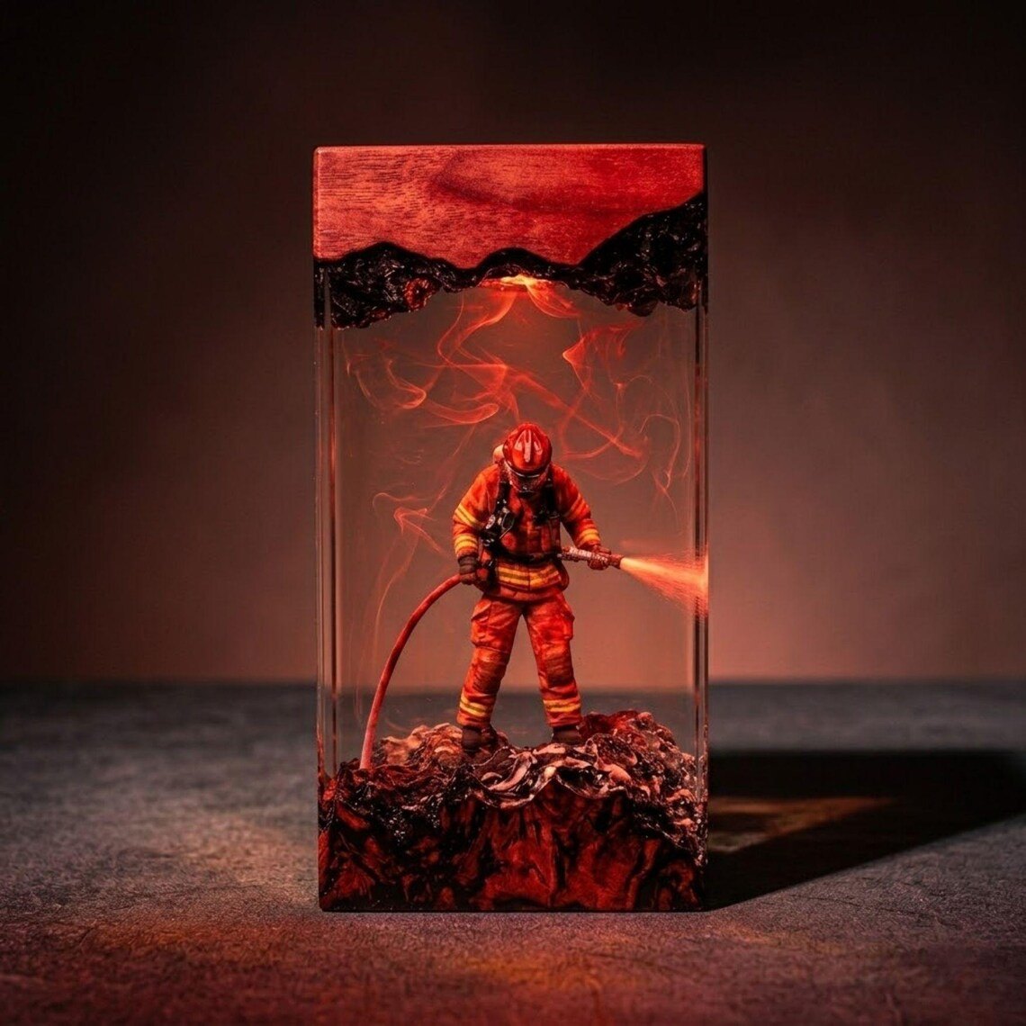 Firefighter resin lamp block glowing red with red wood top