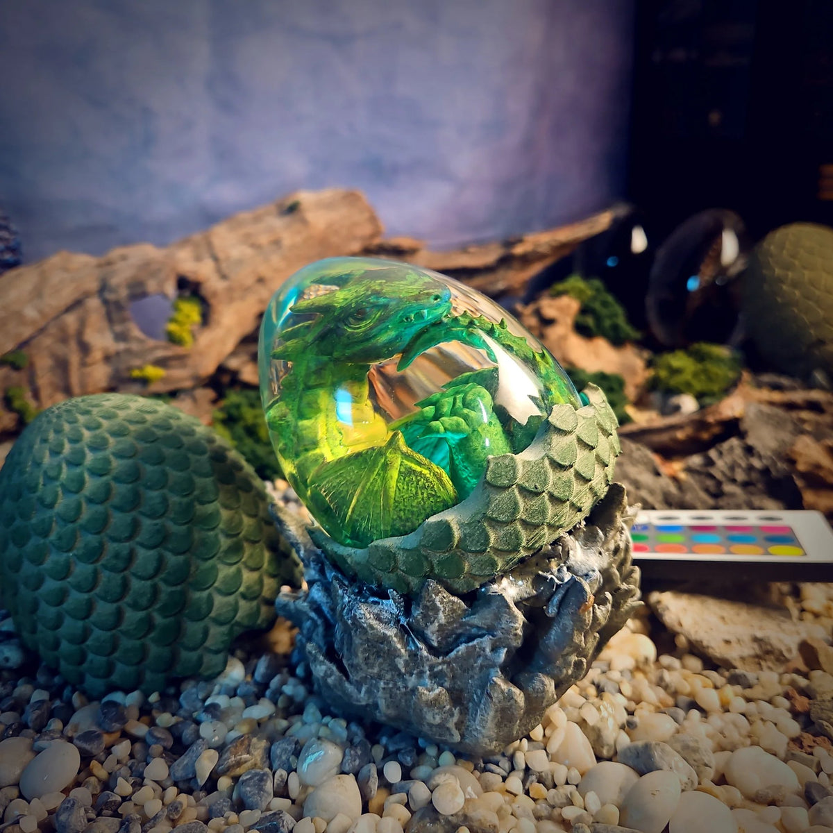 Green baby dragon egg resin lamp on its rock cradle