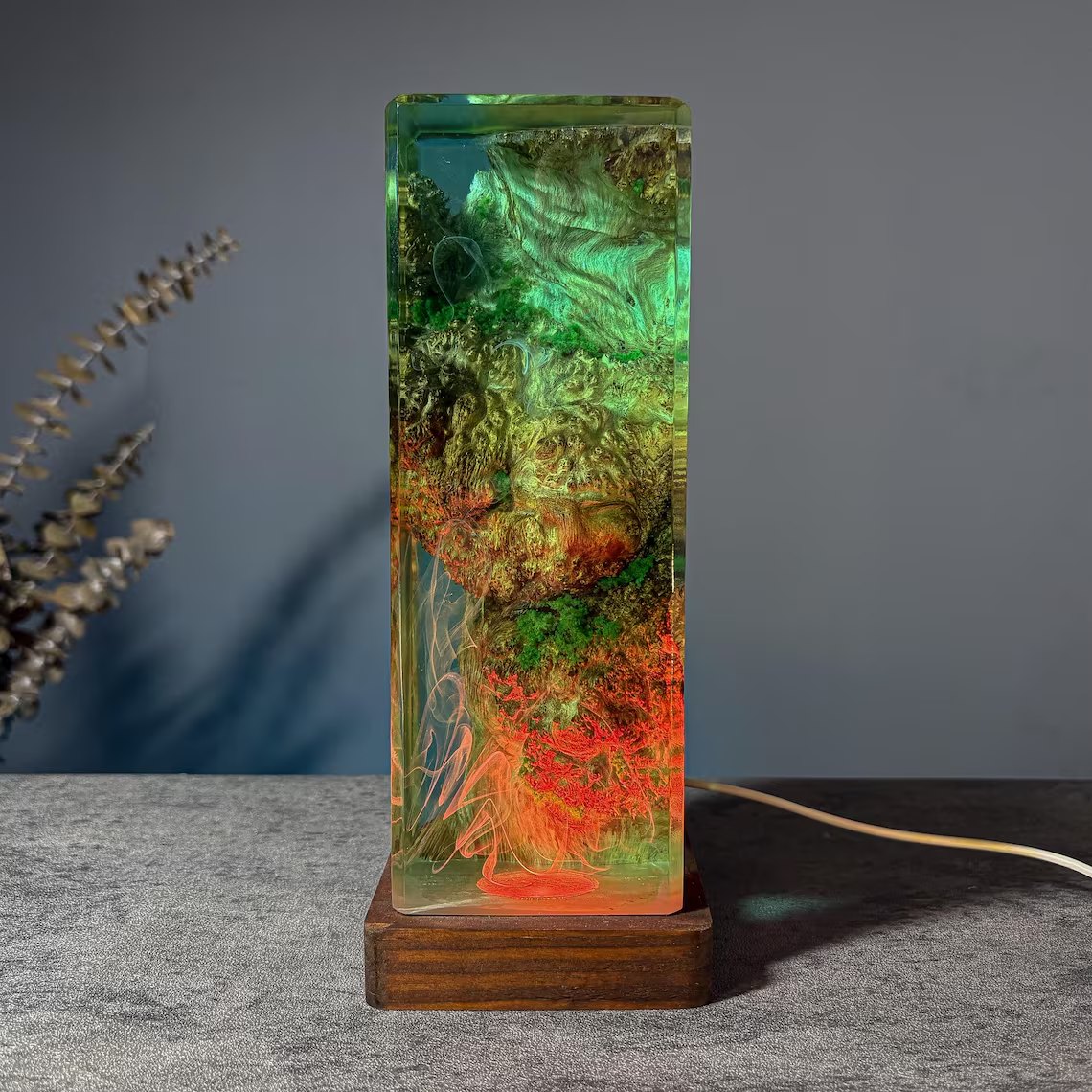 Moss resin lamp with green and red glow