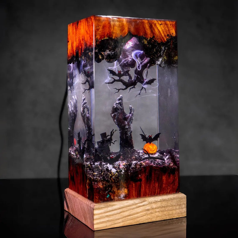 Halloween zombie hands and haunted tree resin lamp on a wood base