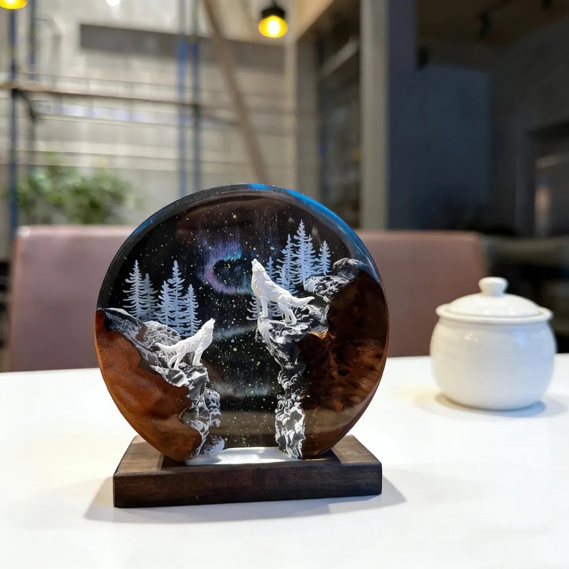 Wolves resin lamp glowing white on a table