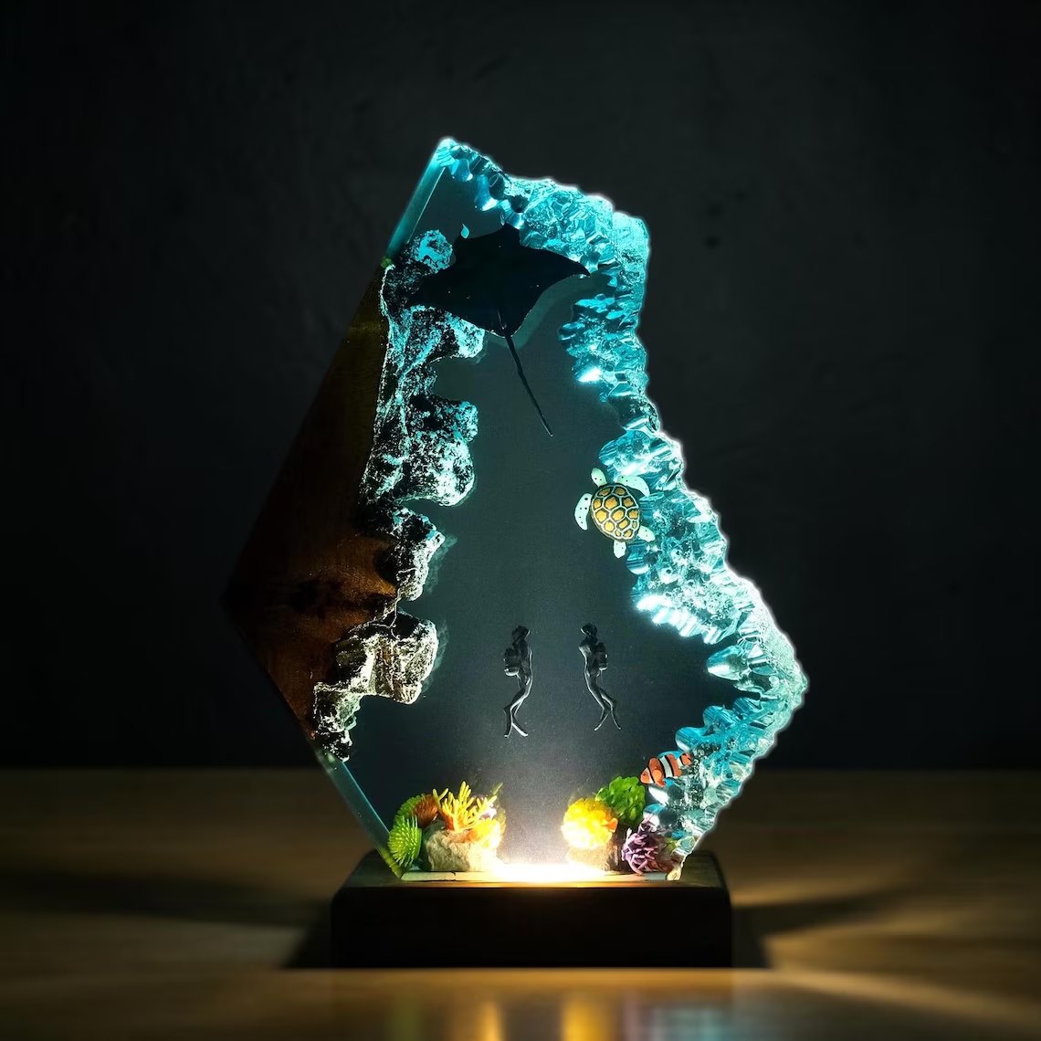 Manta ray and divers resin lamp glowing warm white