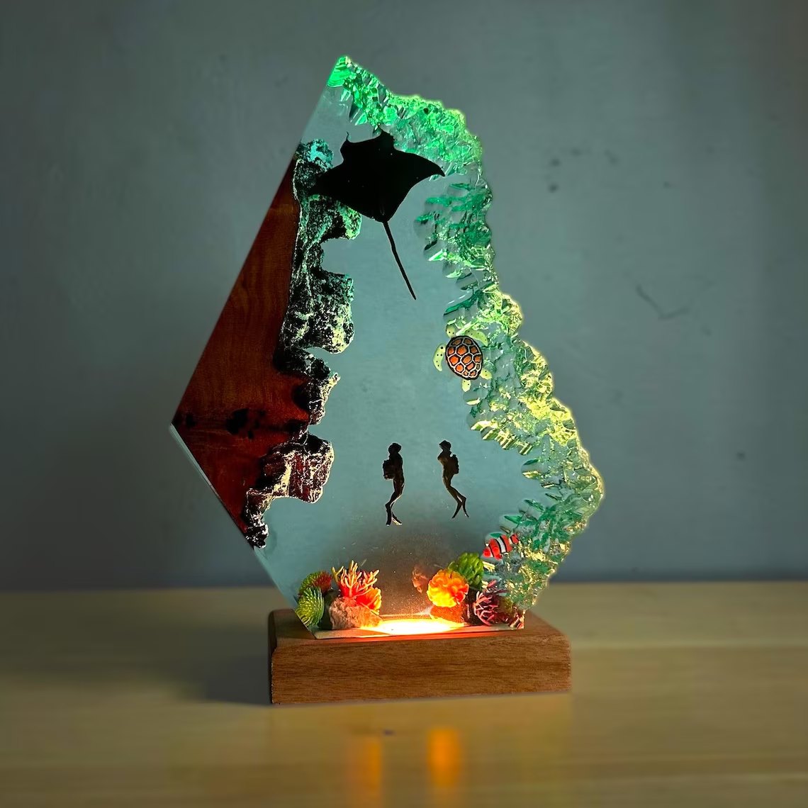 Manta ray resin lamp glowing green and gold