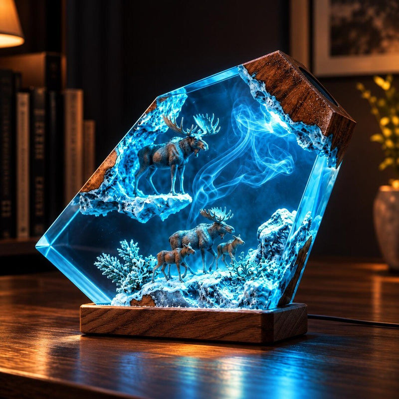 Moose family resin lamp glowing blue on a desk