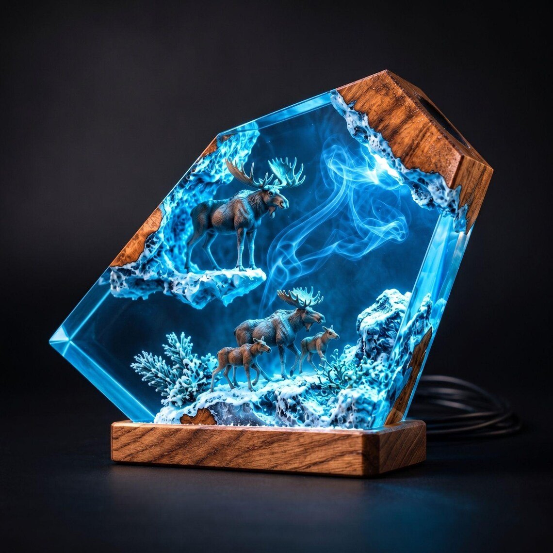 Moose resin lamp glowing blue against a dark background