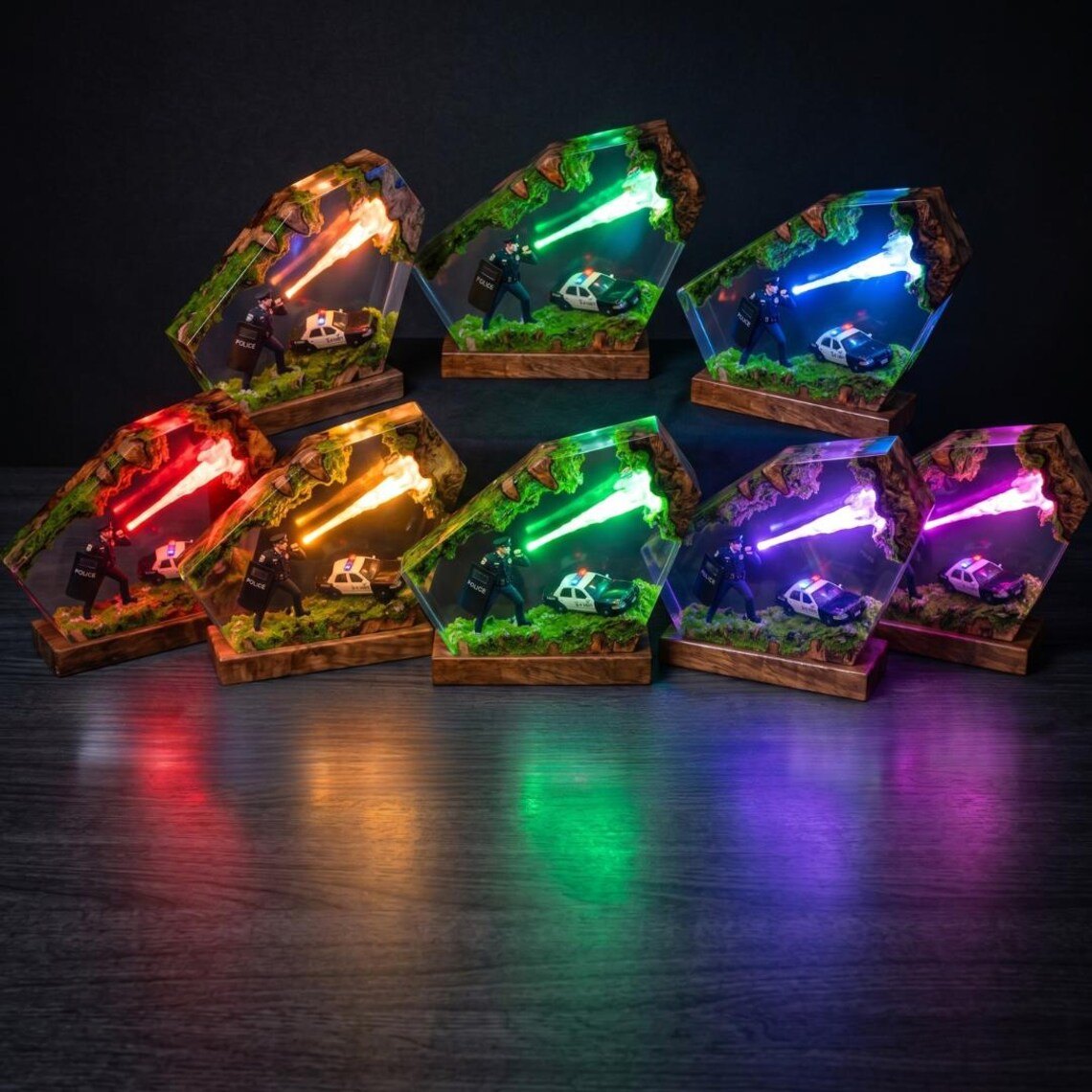 Police resin lamps lined up in several glowing colours