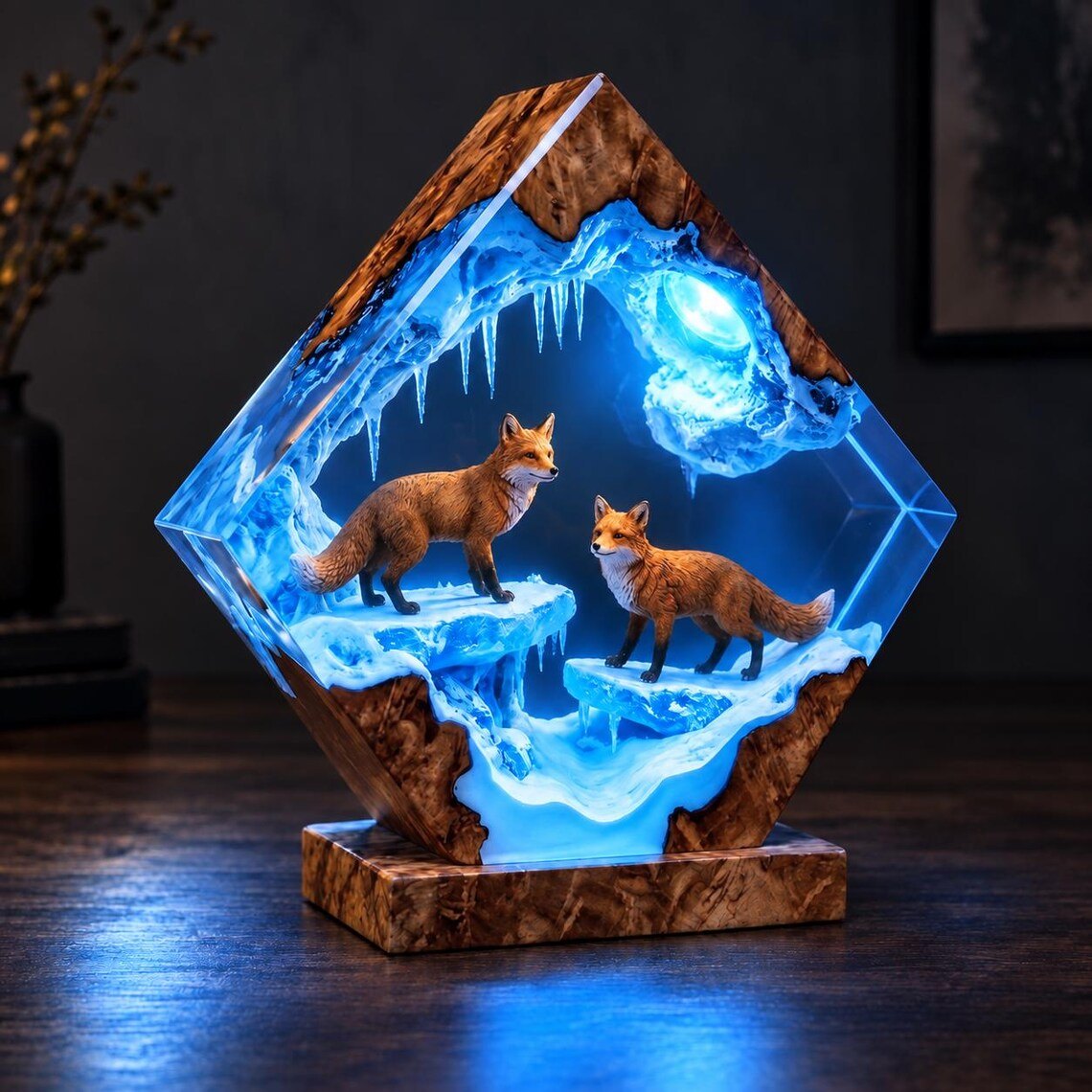 Two red foxes resin lamp lit in blue