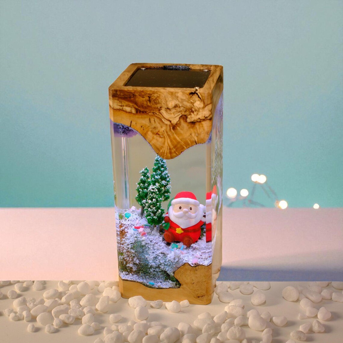 Santa snow scene resin lamp on white pebbles