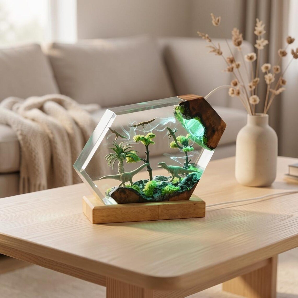 Sauropod and theropod resin lamp with green light on a wood stand