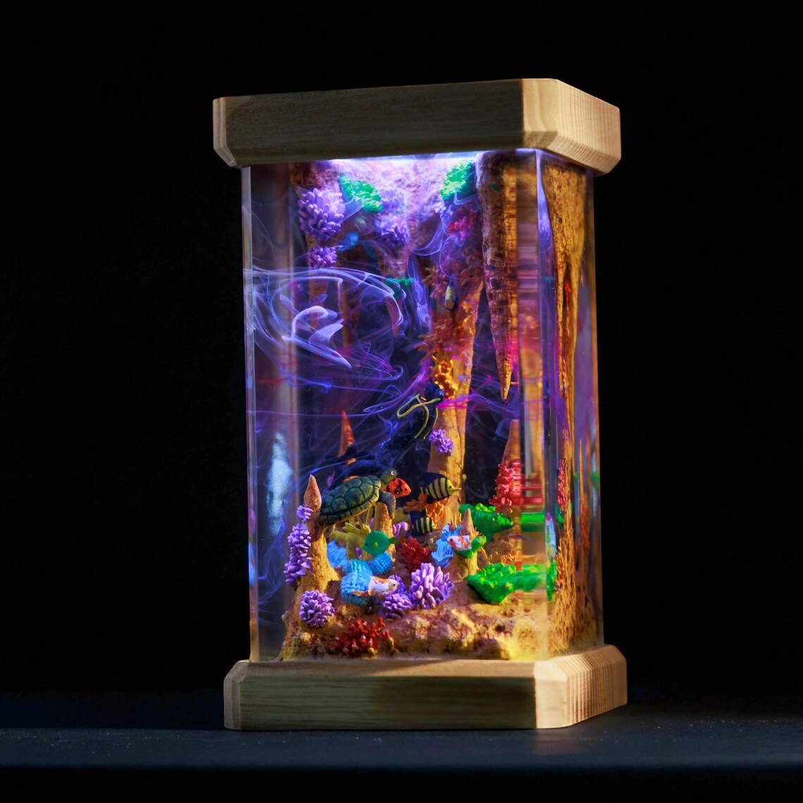 Diver lamp glowing purple against a dark background