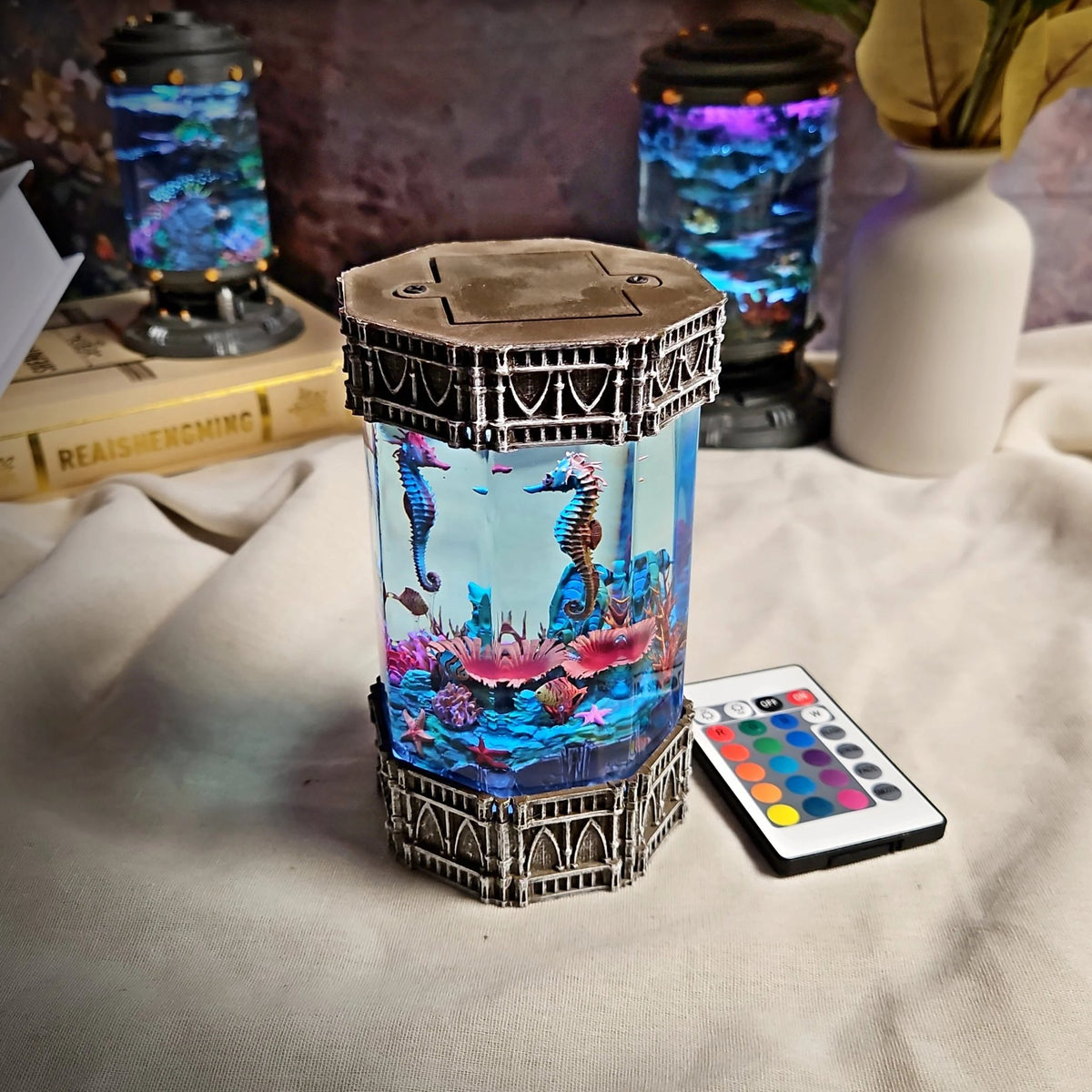 Seahorse resin lamp showing top cap beside the remote