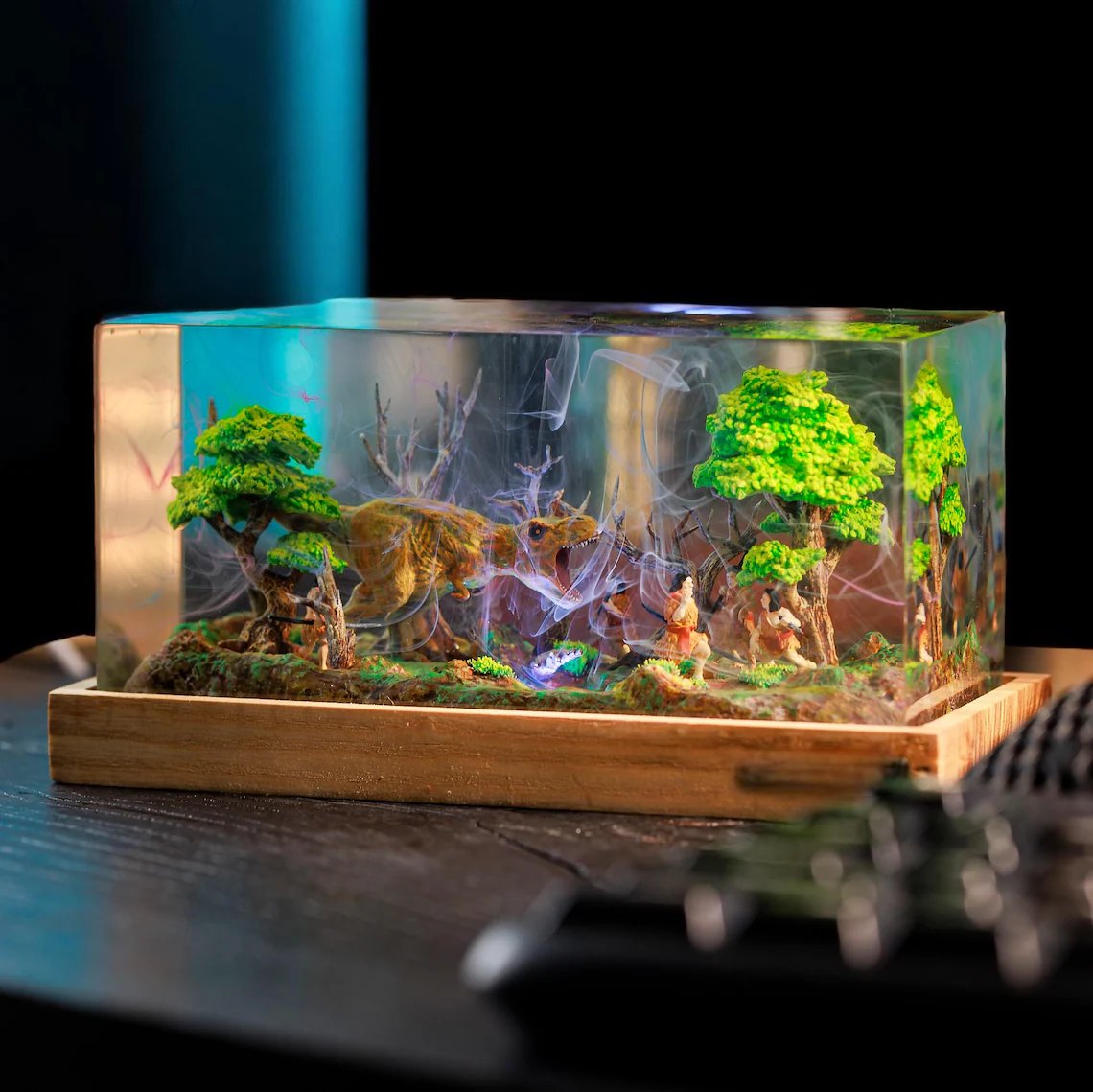 T-Rex diorama resin lamp on a dark desk