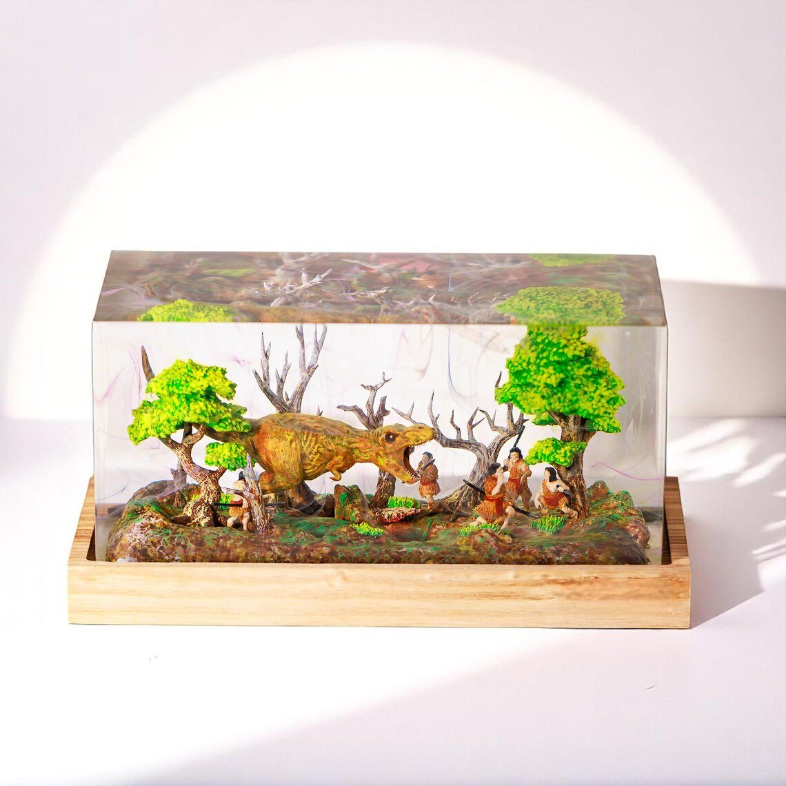 T-Rex and cave hunters resin lamp in daylight