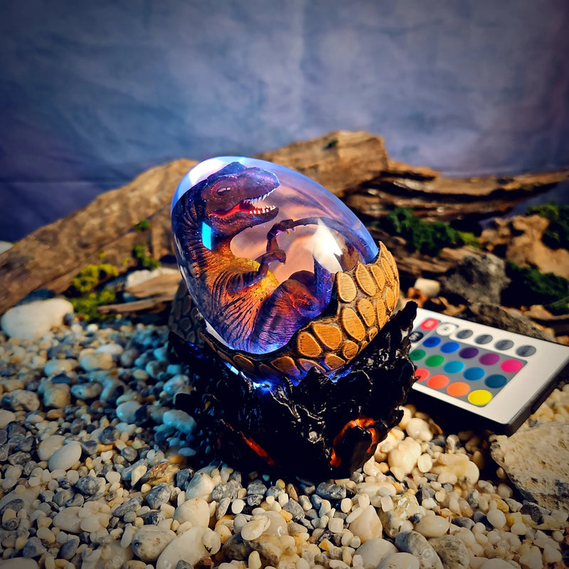 Dinosaur egg resin lamp with a T-Rex embryo glowing lilac