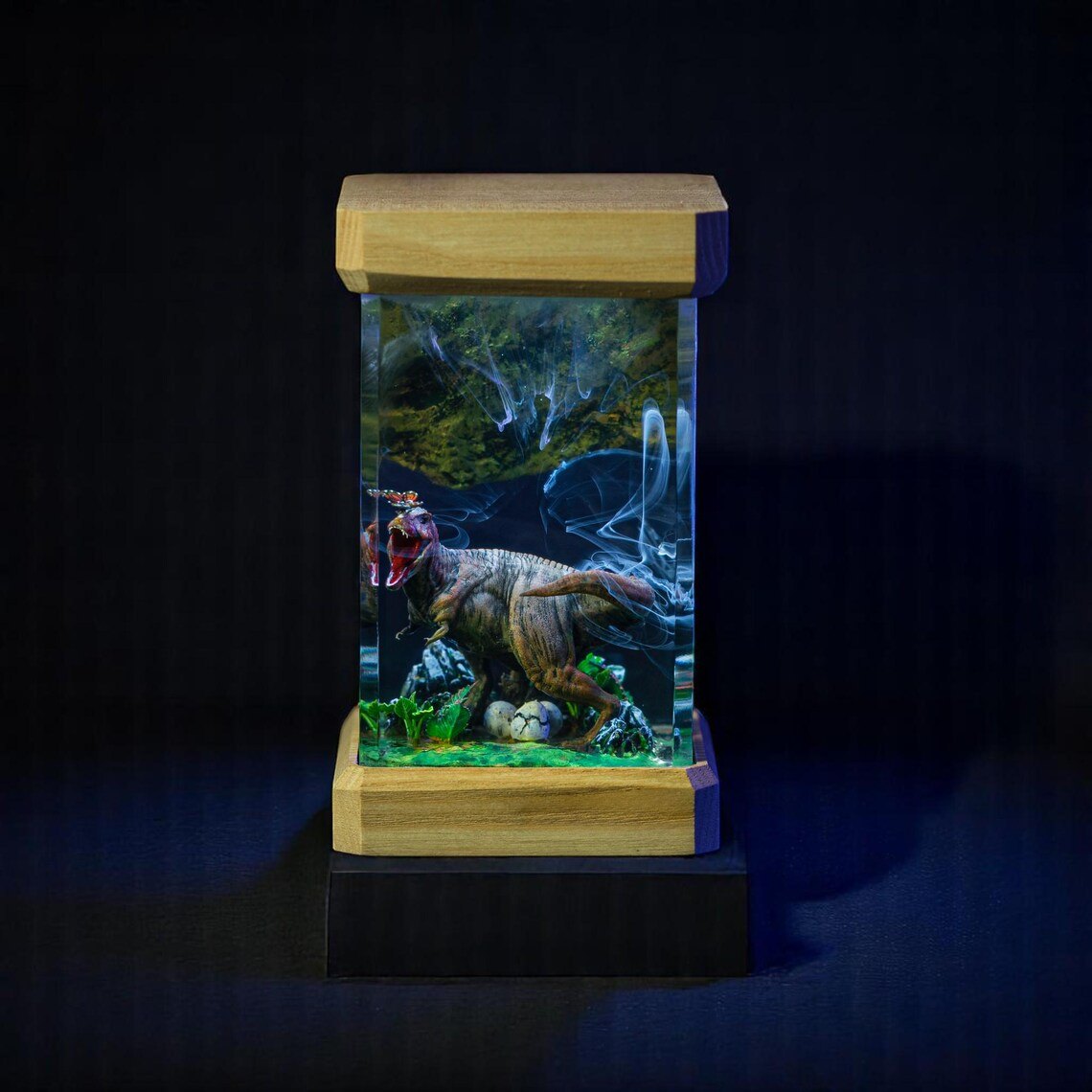 T-Rex nest resin lamp on a dark stand