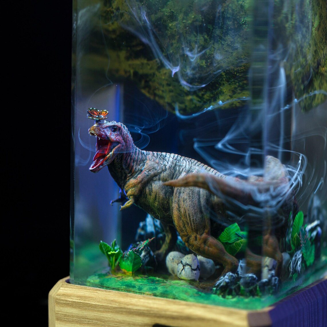 Detail of the T-Rex, ferns and smoke wisps inside the resin