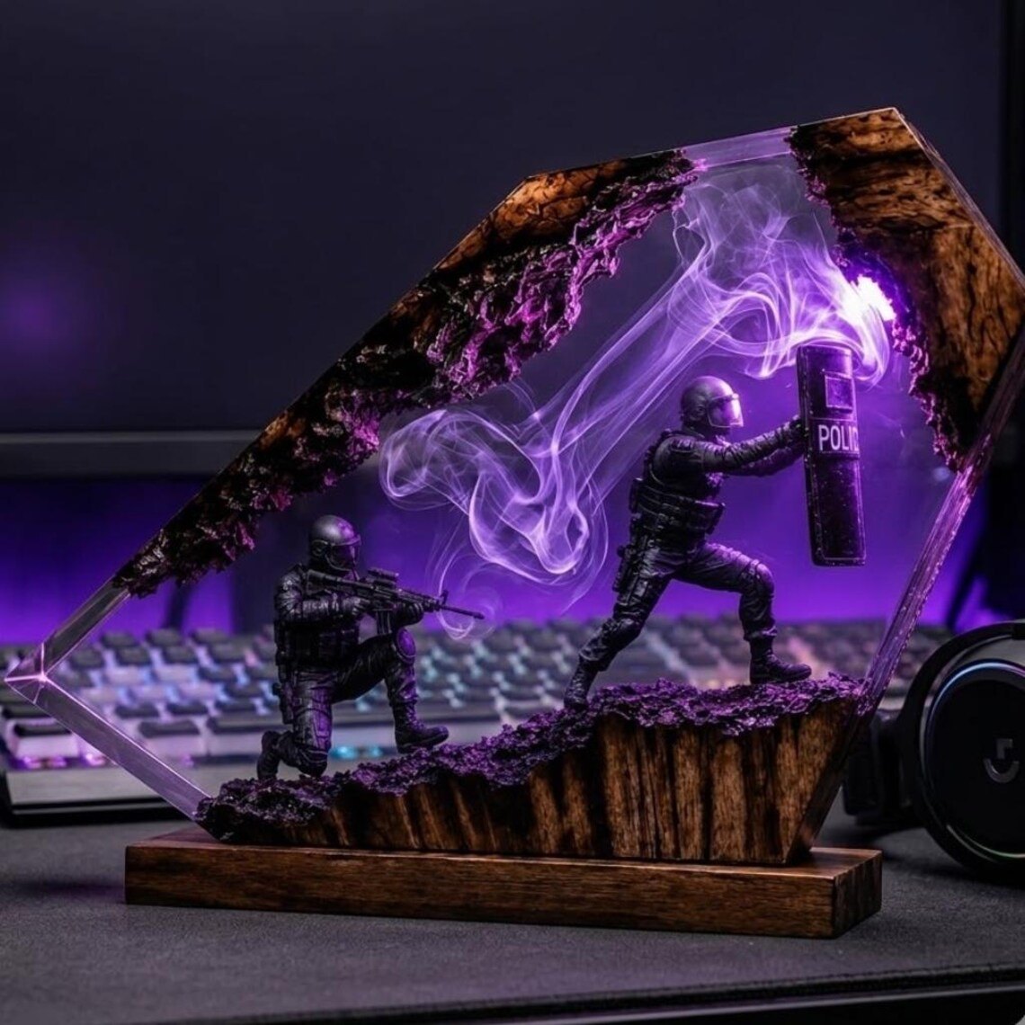 Tactical police resin lamp glowing purple beside a keyboard