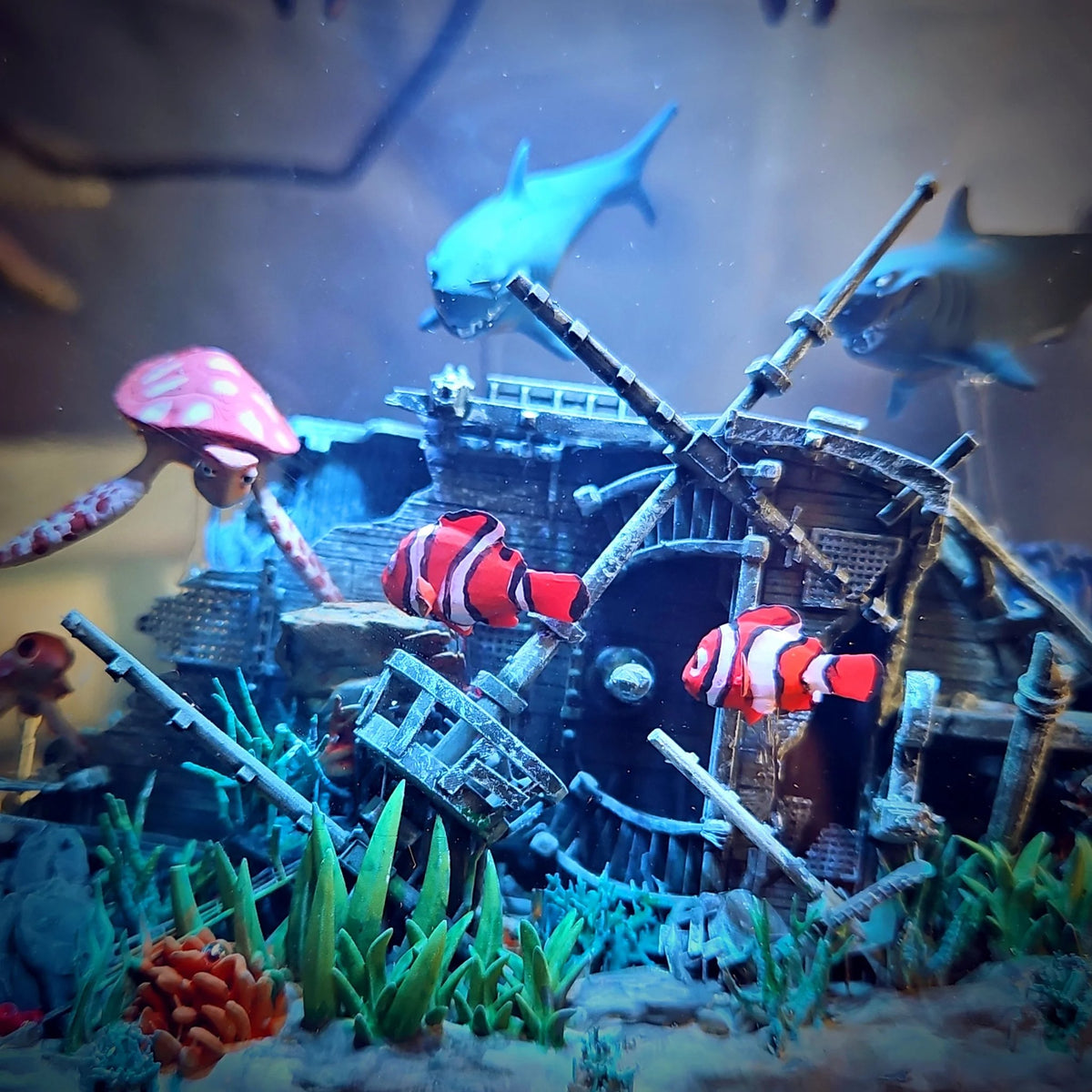 Close-up of shipwreck, clownfish and sharks inside the resin