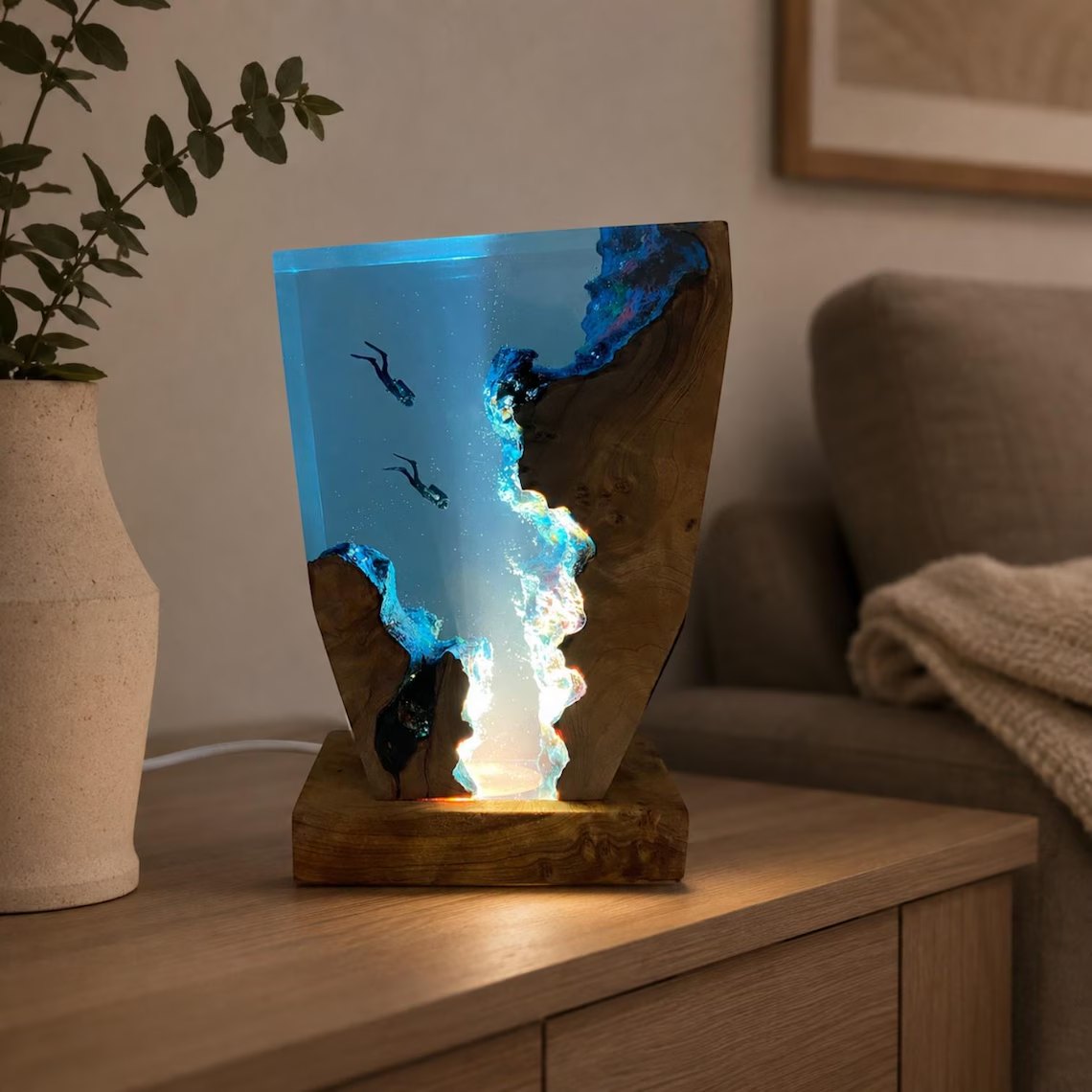 Diver resin lamp glowing on a side table in a living room