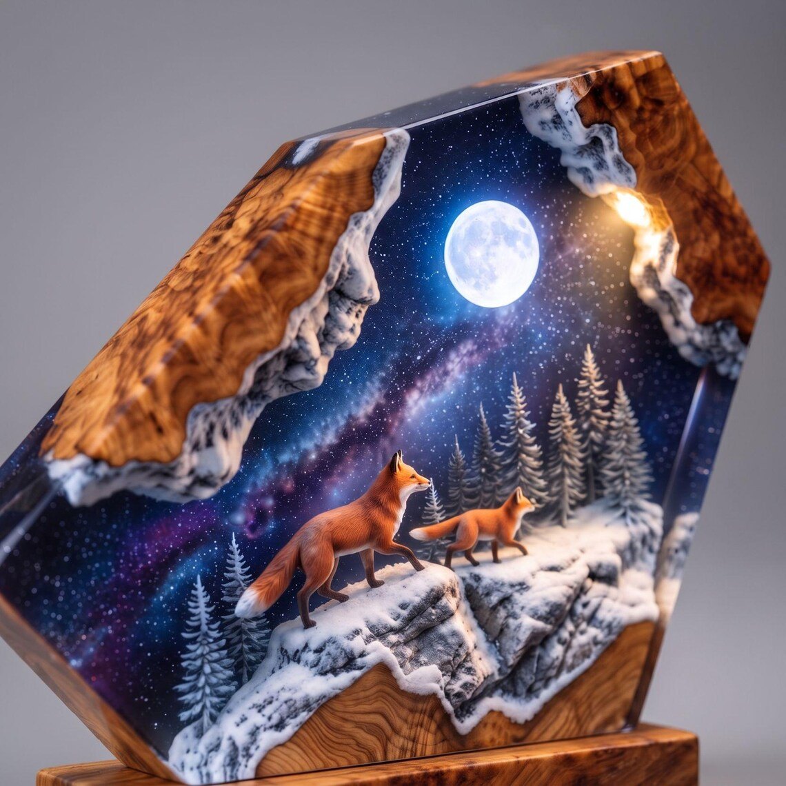 Close view of two foxes, pines and full moon