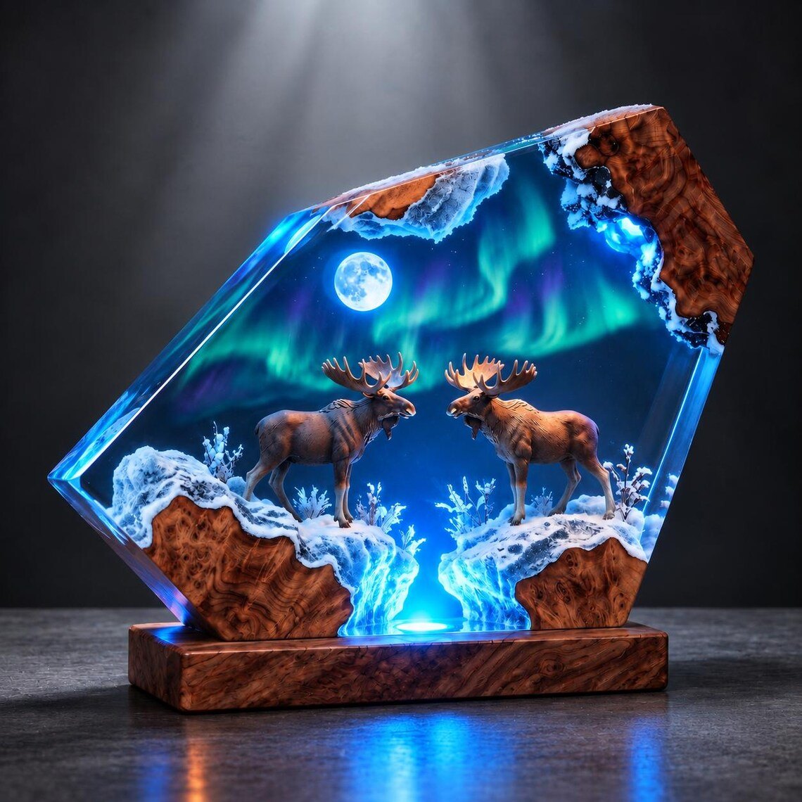 Two moose resin lamp with burl wood base glowing blue