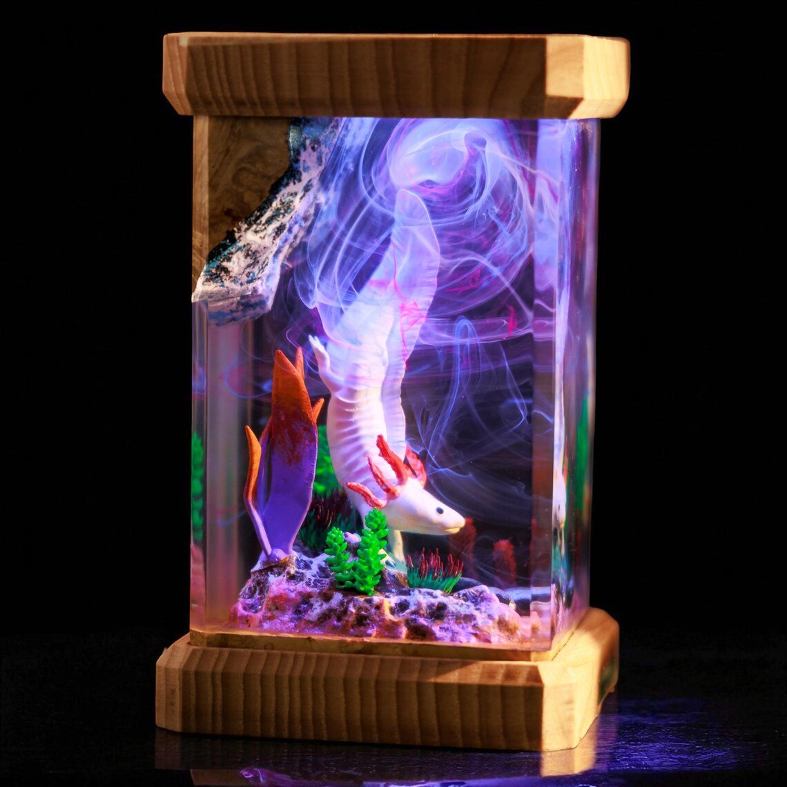 Side view of the axolotl lamp with violet smoke swirls