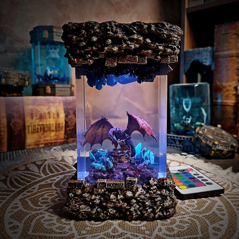 Dragon resin lamp with a winged dragon on crystals glowing lavender