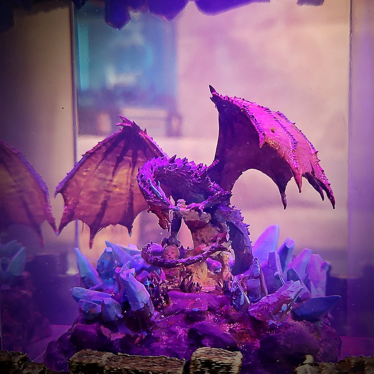 Close-up of the dragon coiled around a stone tower