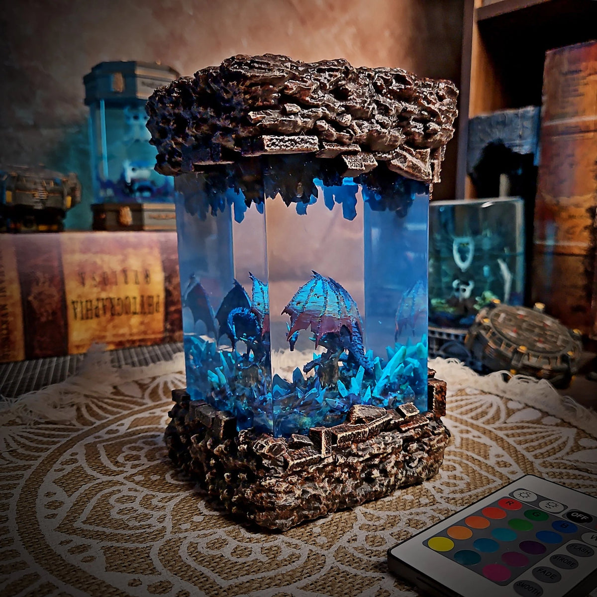 Dragon resin lamp glowing icy blue with remote